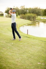 Young man playing golf