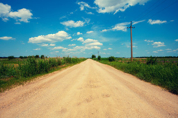 Rural landscape, dirt road in summer
