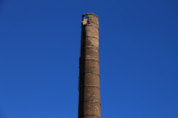 Tall brick chimney in old factory , Bosnia and Herzegovina