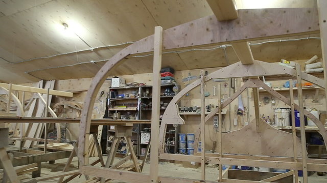 Start of construction of a boat at the shipyard, frames installed on the slipway in the carpentry workshop

