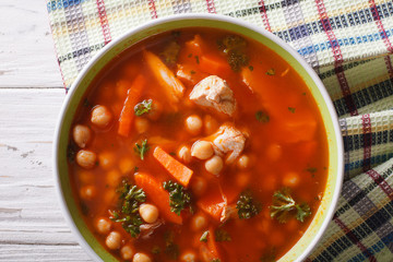 Chickpea soup with chicken closeup. horizontal top view

