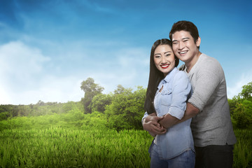 Asian couple hug and smiling