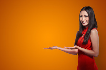 Chinese woman in cheongsam dress smile