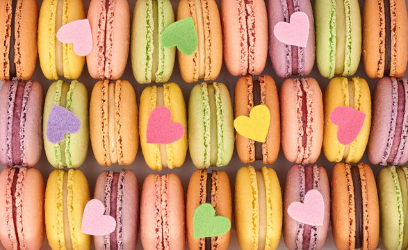 French colorful macarons background, close up