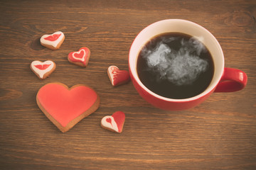 Heart cookies with cup of coffee, toned