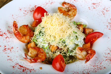 Caesar salad with tiger shrimps