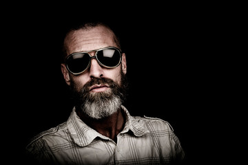 Portrait of a man with beard and sunglasses