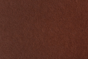 Closeup of abstract grunge brown paper background.