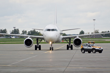 Airplane taxiing after Follow me car