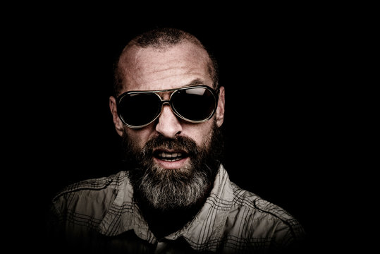 Portrait of a man with beard and sunglasses