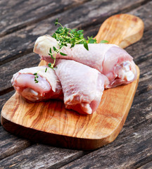 Raw Chicken Drumsticks with thymi
