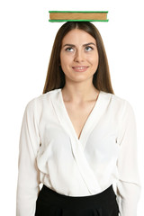 Woman with book on head