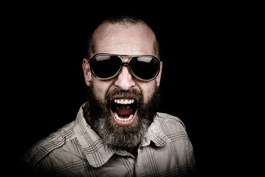 Portrait of a man with beard and sunglasses