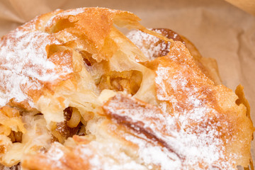Closeup of heat apple puff cake.
