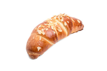 Delicious croissant with grated almonds. 