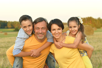 Happy family in wheat field