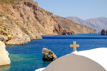 Detail view of white chapel and ocean background