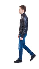 Naklejka premium Back view of going handsome man in jacket.