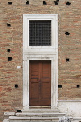 Fototapeta na wymiar Wooden medieval squared style front door