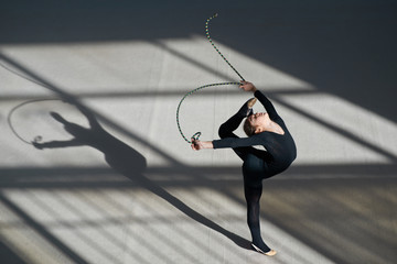 girl making   balance rope. rhythmic gymnastics.