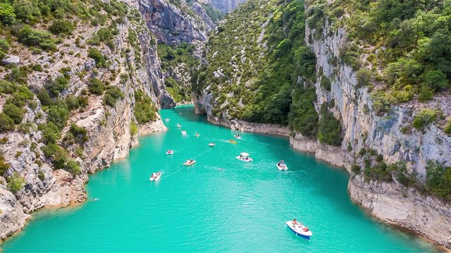 People rowing and recreating in Verdon Gorge, on mouth of Le Verdon river, near Aiguines. 