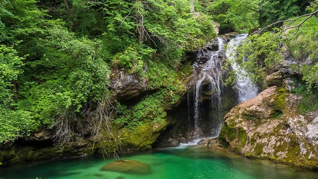 Raw footage of waterfall at the Vintgar gorge, beauty of nature, with river Radovna flowing through, near Bled, Slovenia