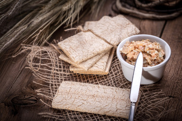 Homemade sandwiches with crisp bread, tuna and egg on a wooden t