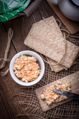 Homemade sandwiches with crisp bread, tuna and egg on a wooden t