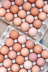 Fresh chicken brown eggs in a tray. Food.
