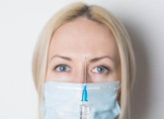 doctor with small syringe