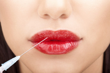 Naklejka premium Woman with syringe