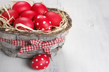 Red Easter eggs in basket