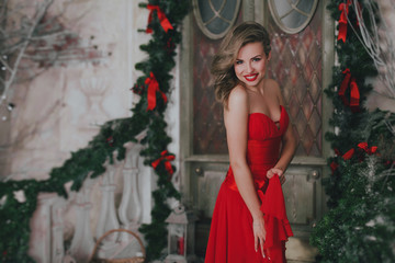 pretty woman in red in christmas time