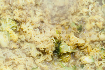Cooking rice with broccoli and selective focus