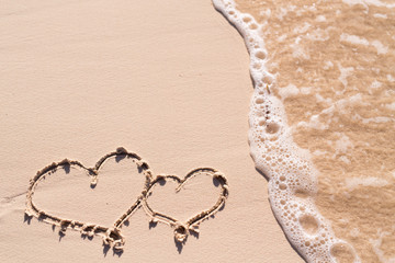 Hearts drawn on beach