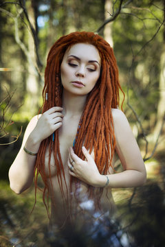 Amazon woman with red dreadlocks