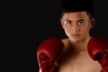 Muay Thai boxing male boxer isolated on black backgrounds