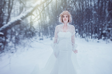 Fototapeta na wymiar Mistery woman in winter forest