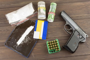 Sales of drugs. International crime, drug trafficking. Drugs and money on a wooden table. The...