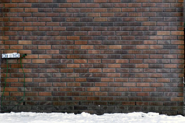 Brick wall and electric cable