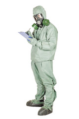 Man with protective mask and protective clothes fills a list of