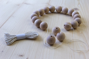 Wooden beads on a wooden background