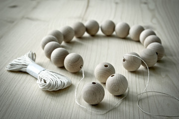 Fototapeta na wymiar Wooden beads on a wooden background