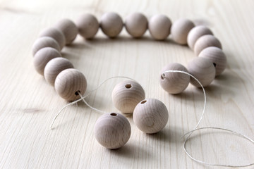 Wooden beads on a wooden background