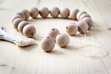 Wooden beads on a wooden background