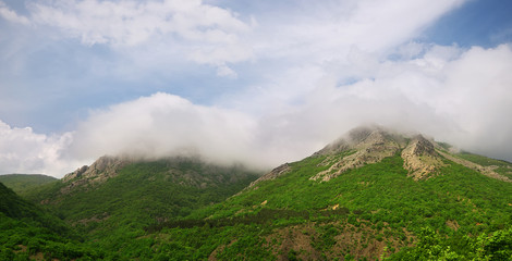 Fototapeta na wymiar clouds on mountain peaks