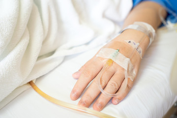 Close up of Asian woman patient in hospital with saline intraven