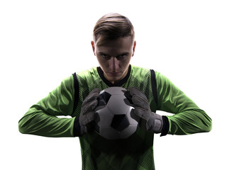 Goalkeeper in green ready to save on white background
