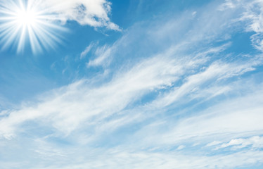 Naklejka na ściany i meble Blue sky with white cloud over light the sun