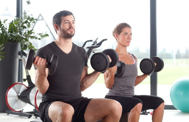 Naklejka premium Training to become muscular at the gym